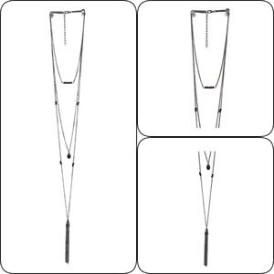 Necklace with purple beads and silver chain.